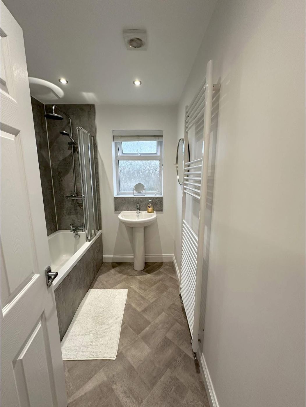Bathroom with shower over bath