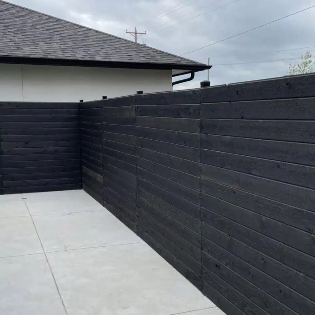 Horizontal slatted fence, dark finish