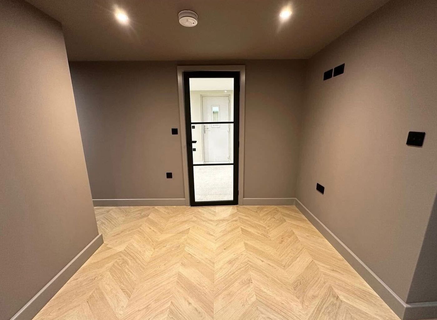 Hallway with new downlights, sockets and switches