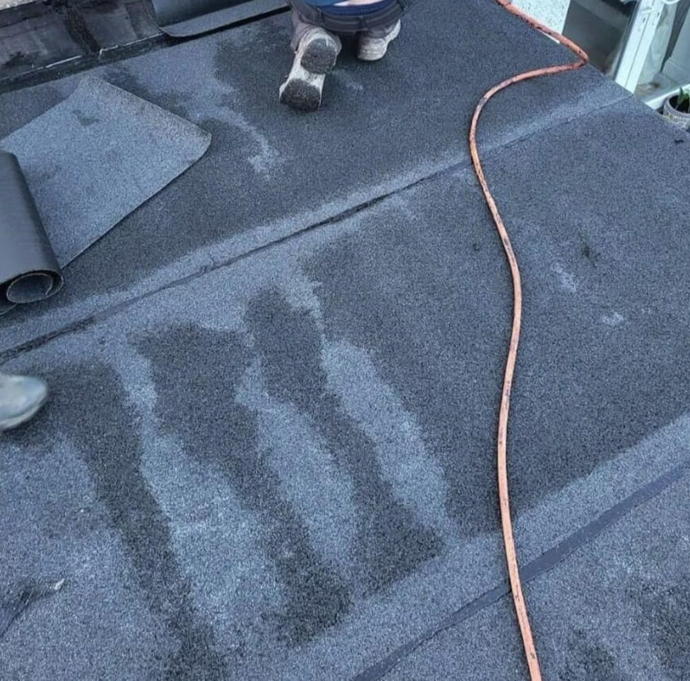Felt flat roof being laid